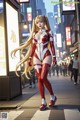 A woman in a red and white outfit is walking down the street.